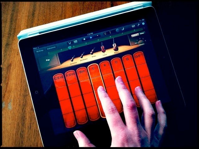 White hand using garageband, one of the best free daws