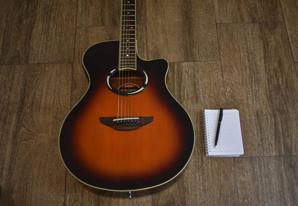 music producer guitar and notebook